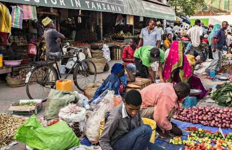 STONE TOWN, TANZANIA - January 2018 Overcrowded local fruit and vegetable market with lots of sellers and buyers in Stone town, Zanzibar, Tanzania